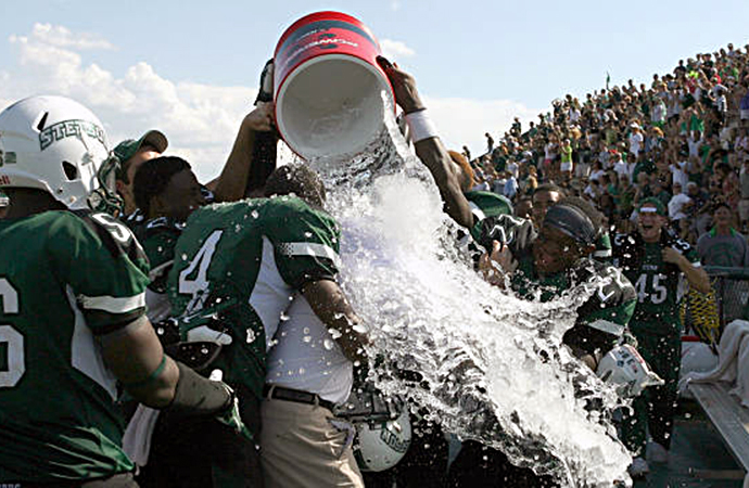 Stetson head coach Roger Hughes gets a gatorade shower from the Hatters following the victory. (photo by: PhotosinMotion.net)